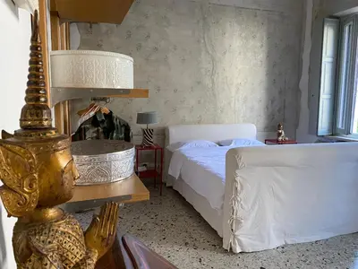 Letto o letti in una camera di 7.Frecavalli Appartamento in Palazzo d'epoca