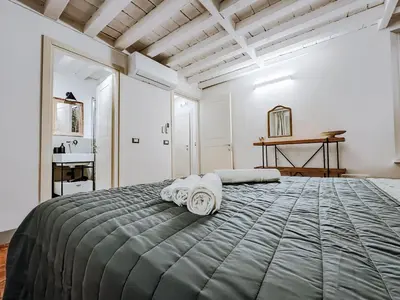Letto o letti in una camera di Modena Prestige, la Porta sul Centro