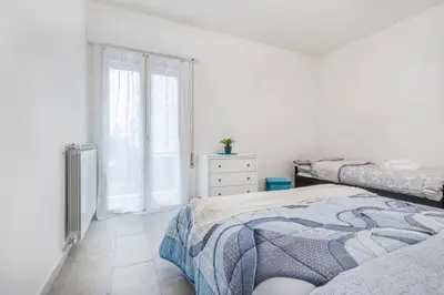 Letto o letti in una camera di Minimalist Oasis - City life & Hesperia Hospital
