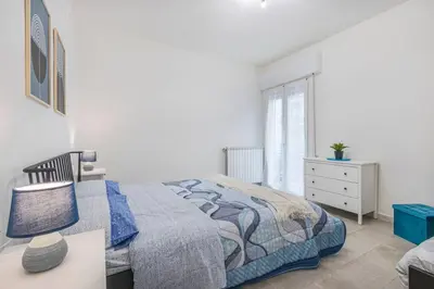 Letto o letti in una camera di Minimalist Oasis - City life & Hesperia Hospital