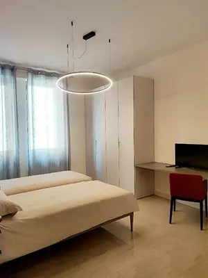 Letto o letti in una camera di Foresteria Juvarra