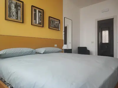 Letto o letti in una camera di Foresteria Juvarra