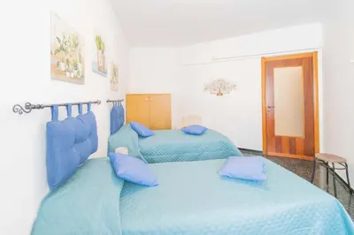 Letto o letti in una camera di 147- Ca' da Lice nel centro di Sestri Levante, 5 minuti Baia del Silenzio, Mare e Spiaggia