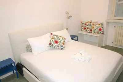 Letto o letti in una camera di Appartamento al Duomo di Parma - posto auto privato prenotabile