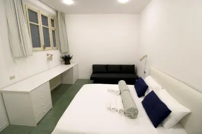 Letto o letti in una camera di Appartamento al Duomo di Parma - posto auto privato prenotabile