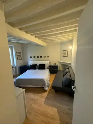 Letto o letti in una camera di Beautiful Center Apartments - posti auto privati prenotabili