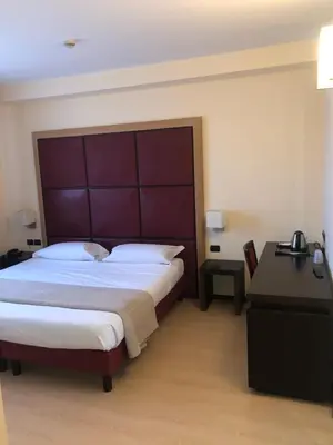 Letto o letti in una camera di ALBA HOTEL