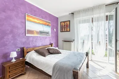 Letto o letti in una camera di Lilly House - Travacò Siccomario - by HOST4U