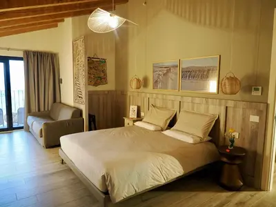 Letto o letti in una camera di Il Viaggio Impresa Sociale