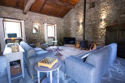 Area soggiorno di Charming & Authentic Stone House La Brugna