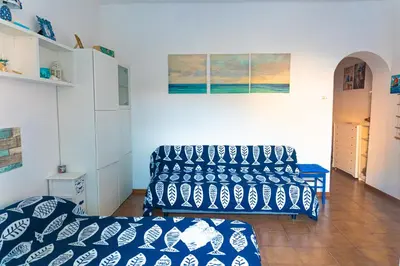 Letto o letti in una camera di Paradiso blu Riva Trigoso