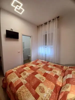 Letto o letti in una camera di Affittacamere l'Aurora