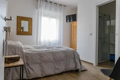 Letto o letti in una camera di Affittacamere l'Aurora