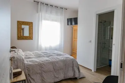Letto o letti in una camera di Affittacamere l'Aurora