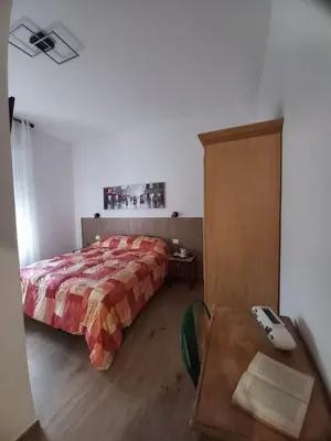 Letto o letti in una camera di Affittacamere l'Aurora
