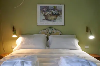 Letto o letti in una camera di Idyllium Relais - Private Retreat with Panoramic Pool & Sea Views