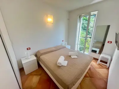 Letto o letti in una camera di Glicine Residenza Prealba con posto auto