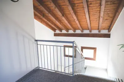 Letto o letti in una camera di Castelletto - Armonia rustica e moderna