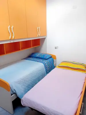 Letto o letti in una camera di Casa Gioele