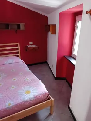 Letto o letti in una camera di Casa Gioele