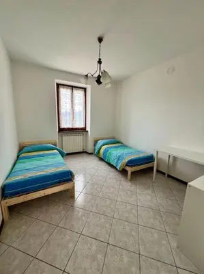 Letto o letti in una camera di Casa Anna Tornolo Val di Taro