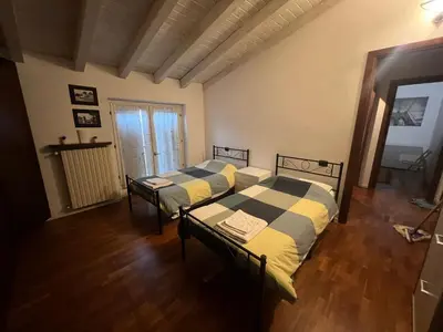 Letto o letti in una camera di Terrazza su Volta Mantovana