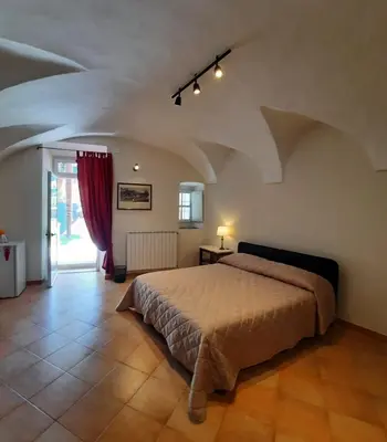 Letto o letti in una camera di Ninì - Casa torre nel borgo
