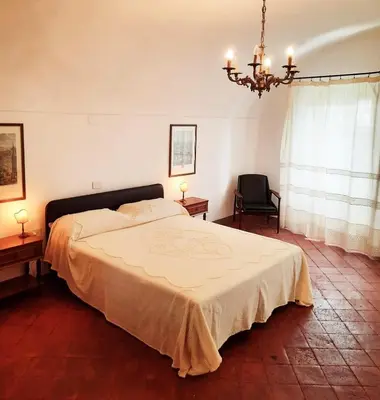 Letto o letti in una camera di Ninì - Casa torre nel borgo