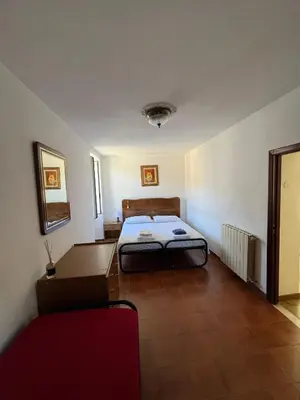 Letto o letti in una camera di Casa Gio'