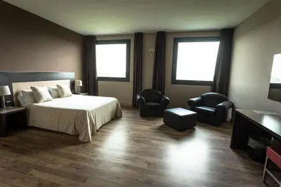 Letto o letti in una camera di HOTEL DON CAMILLO