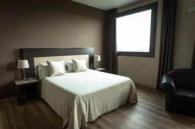 Letto o letti in una camera di HOTEL DON CAMILLO