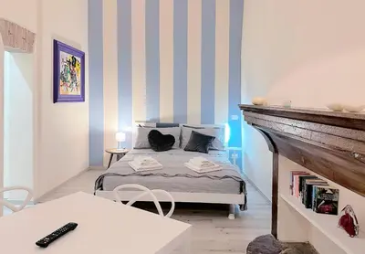 Letto o letti in una camera di 300m dal Duomo - Due Magnifici Appartamenti Moderni