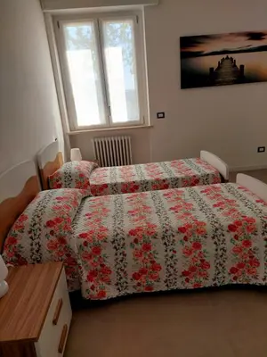 Letto o letti in una camera di Residenza S.Ambrogio