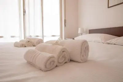 Letto o letti in una camera di CasaViva - Cozy Bilo with Parking in Rapallo