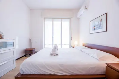Letto o letti in una camera di CasaViva - Cozy Bilo with Parking in Rapallo