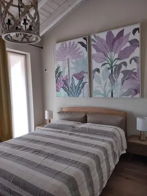 Letto o letti in una camera di Villa Sarita