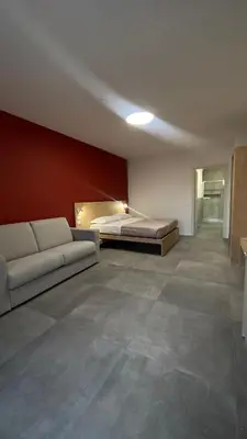 Letto o letti in una camera di Dormi-RE Affittacamere