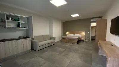 Letto o letti in una camera di Dormi-RE Affittacamere