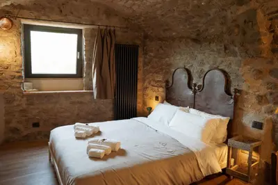 Letto o letti in una camera di La Casa Medievale Suites e SPA