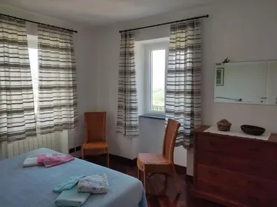 Letto o letti in una camera di Ca'Rossa
