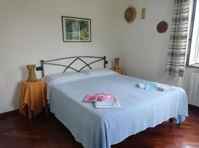 Letto o letti in una camera di Ca'Rossa