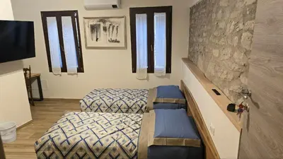 Letto o letti in una camera di Cà Mandarein