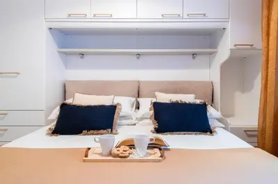 Letto o letti in una camera di Le Pleiadi by PortofinoVacanze