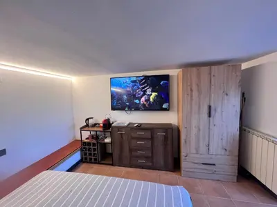 TV o dispositivi per l'intrattenimento presso Santa Giulia Seascape & Garden Rooms
