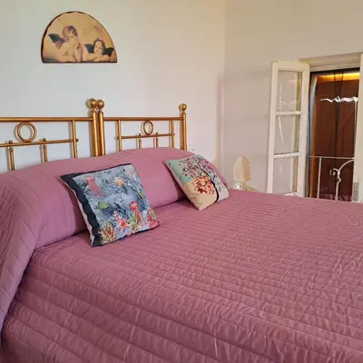 Letto o letti in una camera di Casa Vacanze PetFriendly tra i Vigneti