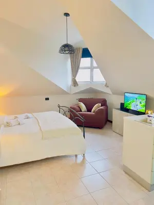Letto o letti in una camera di Attic Pavia - Intero Appartamento
