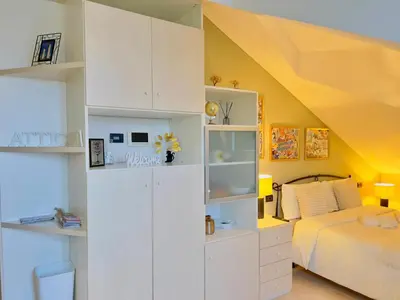 Letto o letti in una camera di Attic Pavia - Intero Appartamento