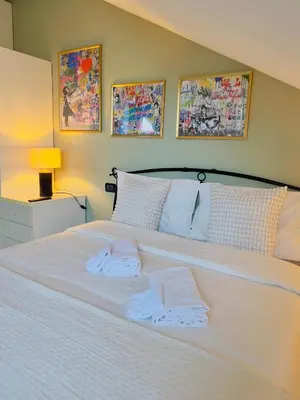 Letto o letti in una camera di Attic Pavia - Intero Appartamento