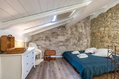 Letto o letti in una camera di Pietra Home