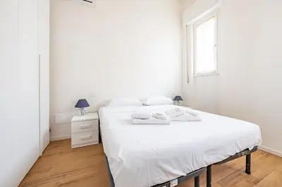Letto o letti in una camera di GuestHost - Deiva Marina Sea House! Functional Apartment